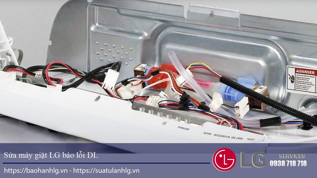 Internal wiring and electronic components of LG washing machine repair, showcasing circuit boards and power connections.